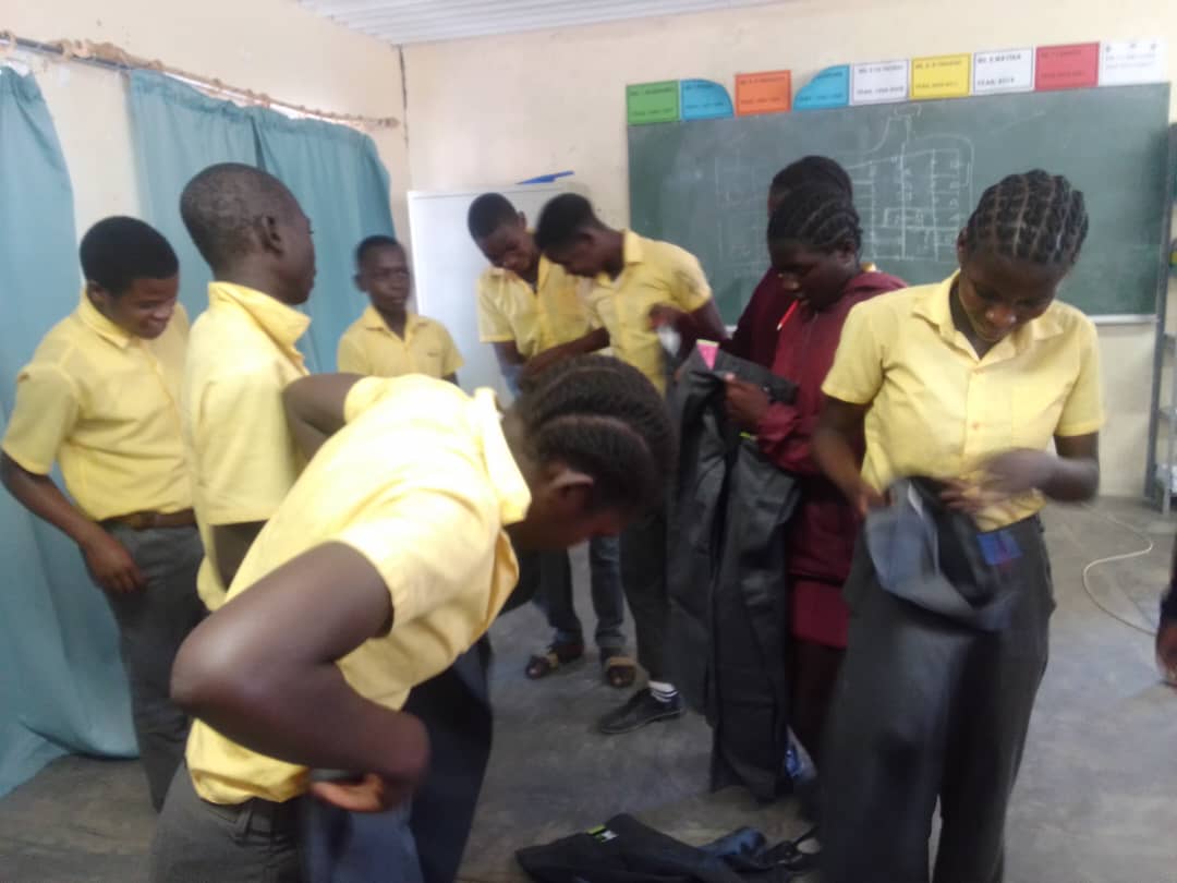 Students receiving school uniforms through MOVSC support program in Rundu, Namibia
